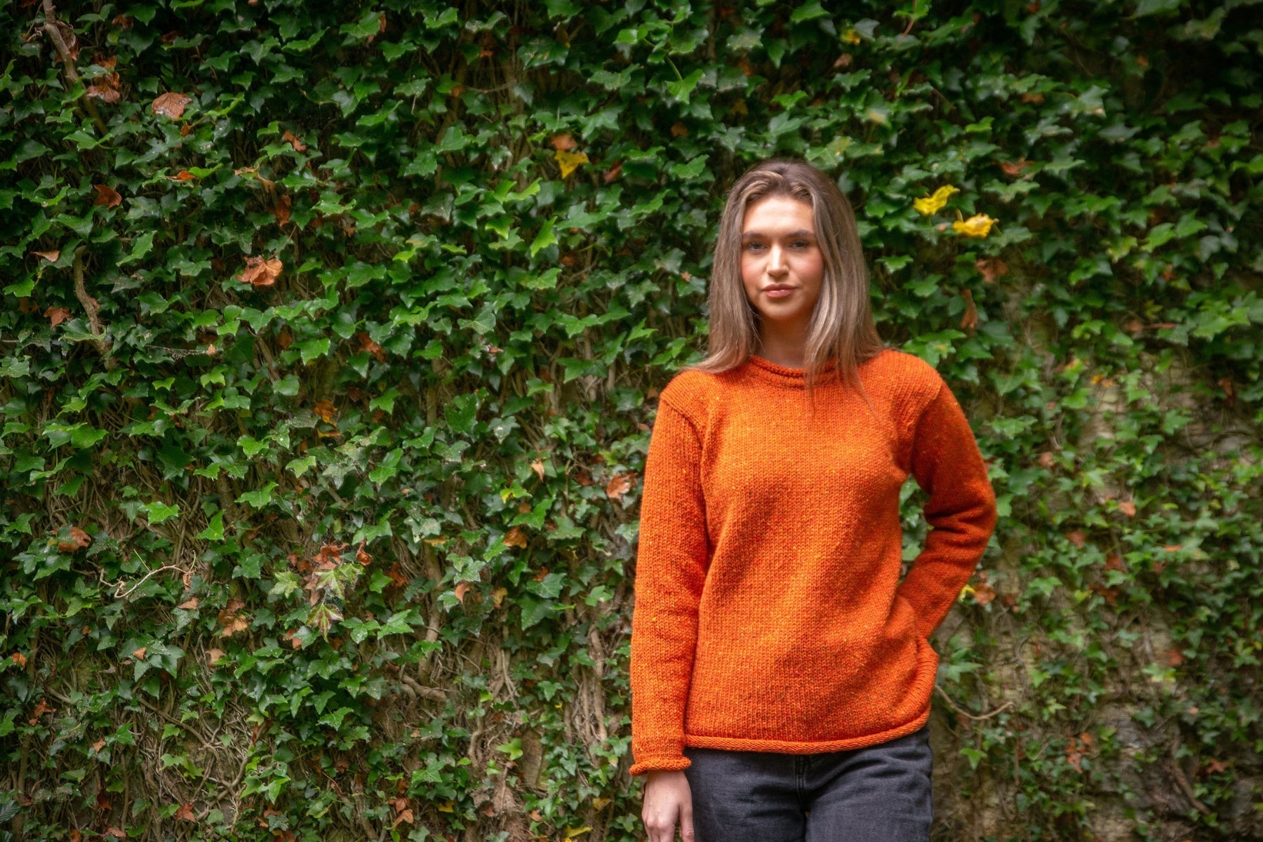 Ladies roll neck wool sweater in Copper Orange, handloomed in Ireland using Donegal wool