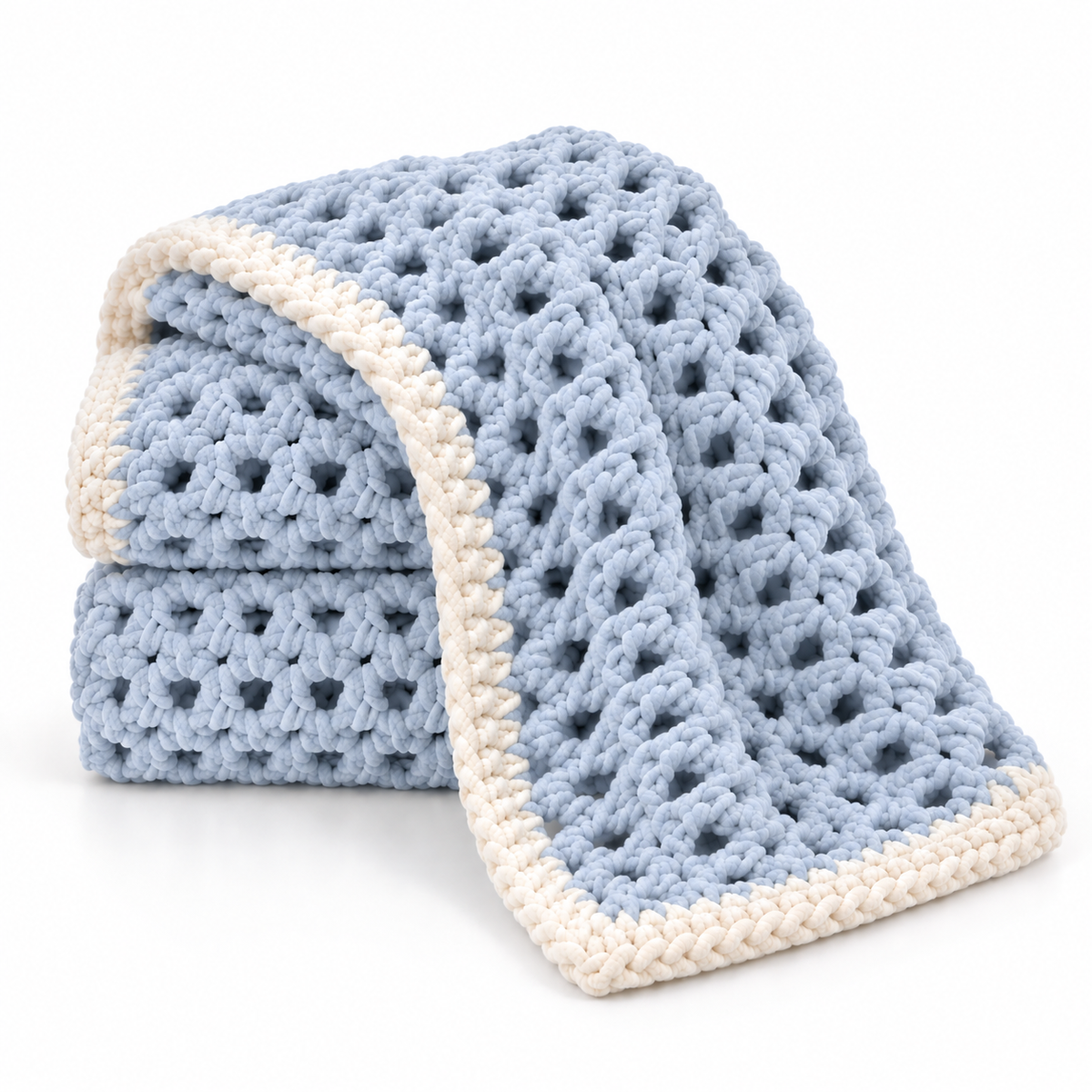 A light blue crocheted blanket with a cream-colored border, folded to show both its textured openwork pattern and the contrasting edge trim, set against a plain white background.