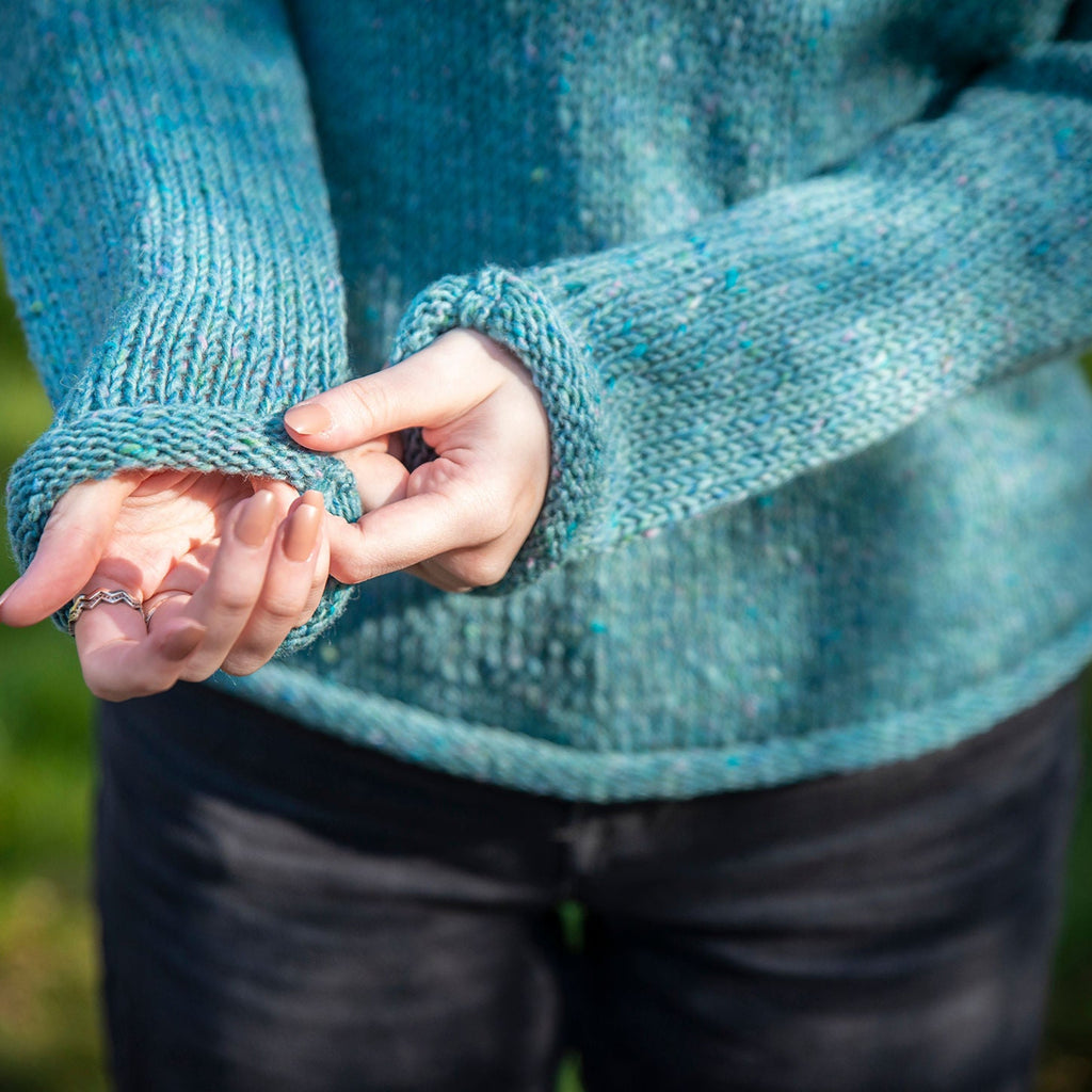 soft blue wool stitching in womens roll neck jumper